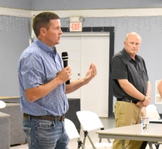 Wabasha County Sheriff Rodney Bartsh delivers his opening statement at a debate July 25. At right is his opponent in the election, Wabasha County Sheriff’s Deputy Jason Bade.